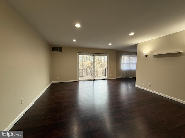 unfurnished living room with recessed lighting, visible vents, baseboards, and dark wood-style flooring