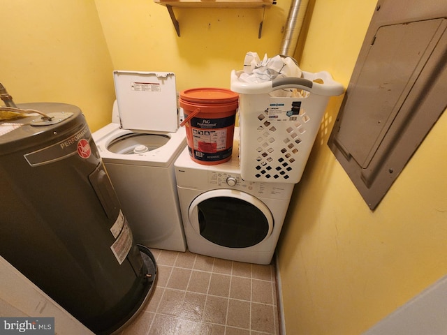 washroom with electric panel, laundry area, and washer and clothes dryer