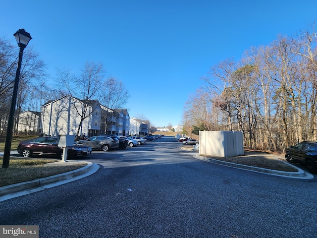 view of street with curbs and street lighting