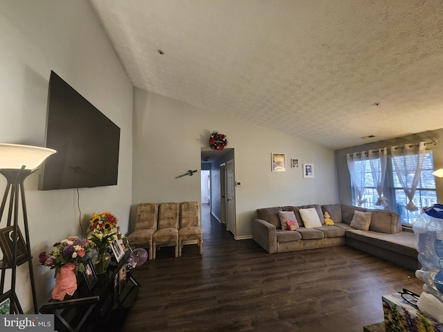 living room featuring a textured ceiling, lofted ceiling, and dark wood-style flooring