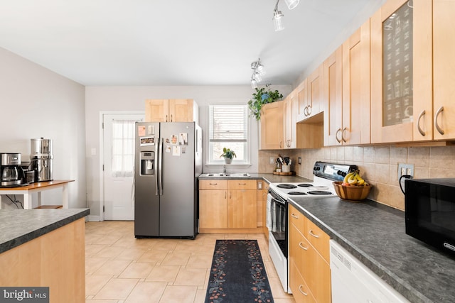 kitchen featuring light brown cabinets, stainless steel refrigerator with ice dispenser, black microwave, and range with electric cooktop