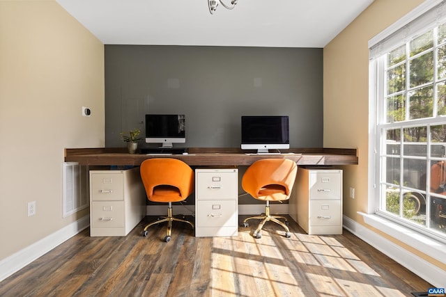 office with visible vents, baseboards, and wood finished floors