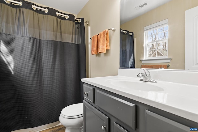 bathroom with a shower with shower curtain, visible vents, toilet, and vanity