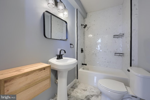 bathroom featuring shower / bathing tub combination, toilet, and marble finish floor