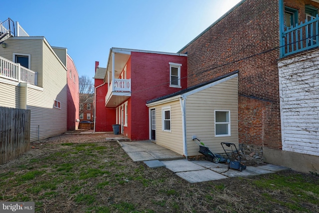 back of house featuring fence