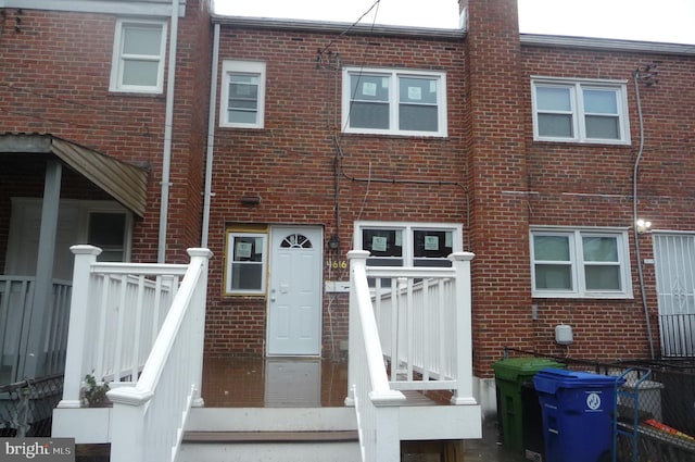 exterior space featuring brick siding