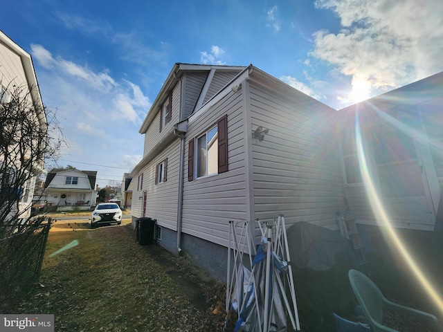 view of side of home featuring a yard