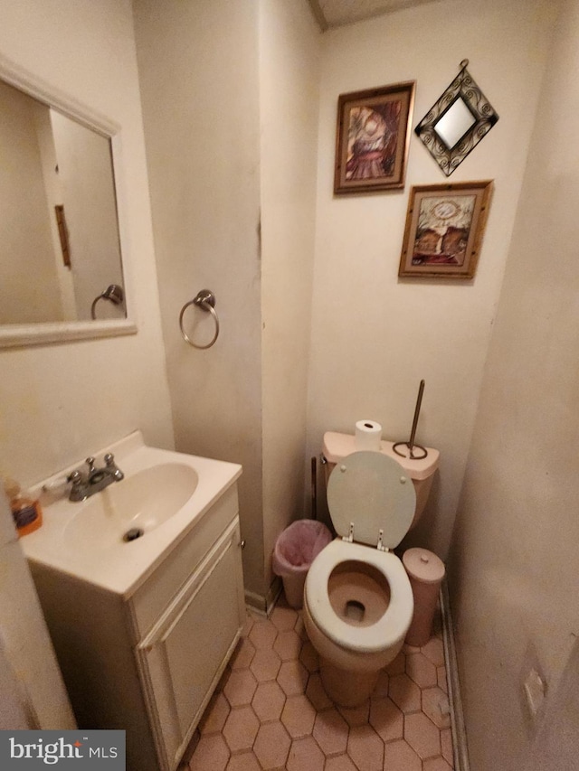 half bath with toilet and vanity