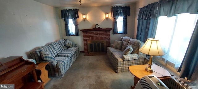 living area with a fireplace and carpet floors