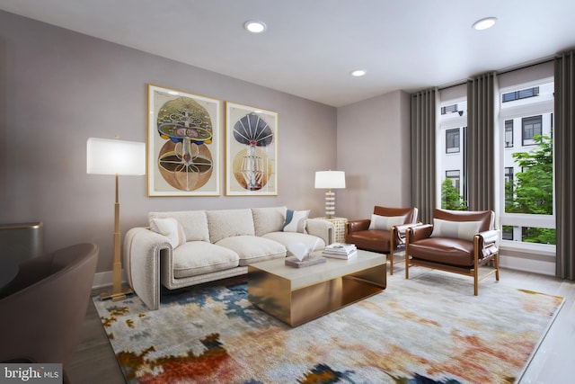 living room featuring wood finished floors, recessed lighting, and baseboards