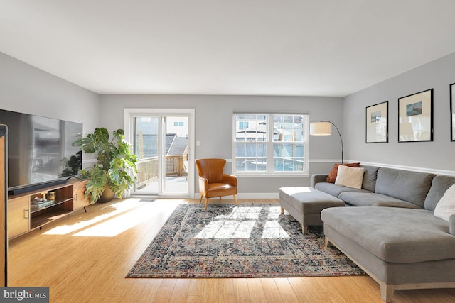 living room with baseboards and hardwood / wood-style floors