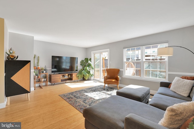 living area featuring wood finished floors and baseboards