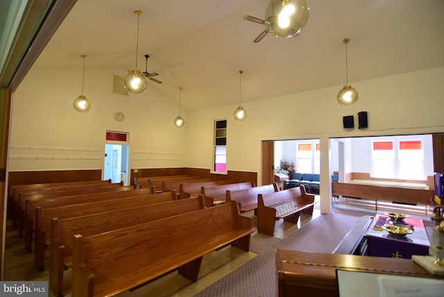 interior space featuring visible vents, carpet flooring, high vaulted ceiling, and ceiling fan