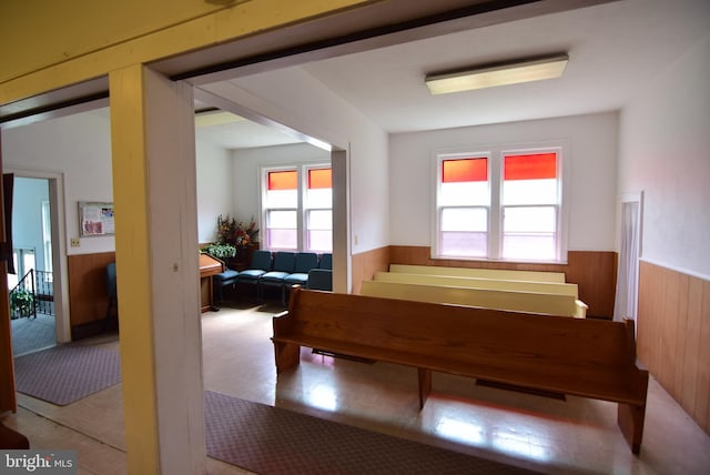 interior space with wooden walls and wainscoting