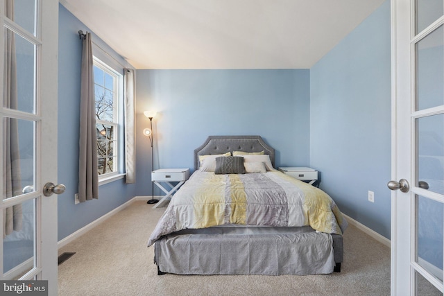 bedroom with visible vents, french doors, carpet, baseboards, and vaulted ceiling