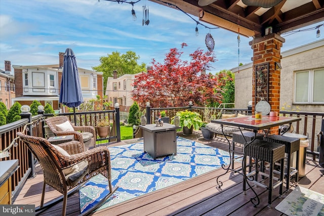 wooden deck featuring outdoor dining area