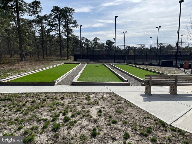 view of community featuring fence