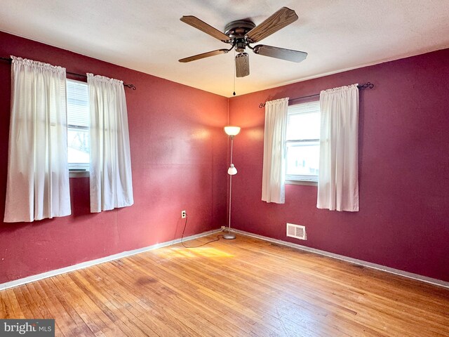 17 Acton, Ewing, NJ 08618 - empty room with hardwood / wood-style floors, visible vents, baseboards, and ceiling fan