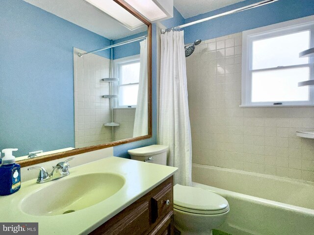 17 Acton, Ewing, NJ 08618 - full bath with shower / bathtub combination with curtain, toilet, a healthy amount of sunlight, and vanity