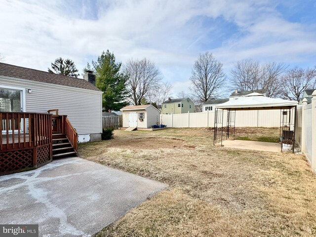 17 Acton, Ewing, NJ 08618 - view of yard featuring a storage shed, an outbuilding, a fenced backyard, and a patio