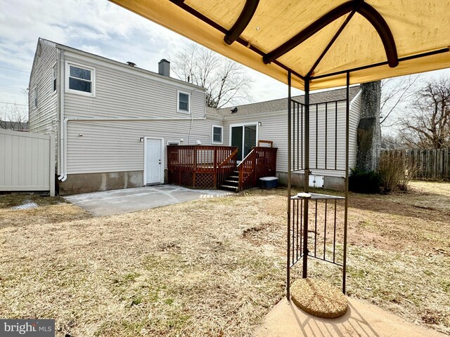 17 Acton, Ewing, NJ 08618 - rear view of property featuring a wooden deck, a patio area, a chimney, and fence