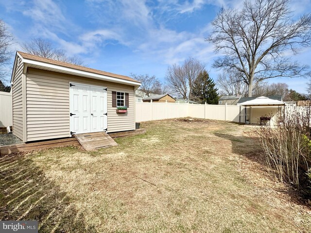17 Acton, Ewing, NJ 08618 - view of yard featuring an outbuilding, a fenced backyard, and a shed