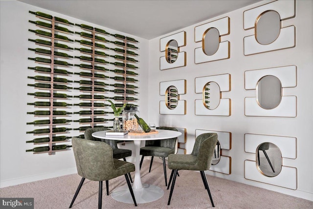 dining room with light colored carpet