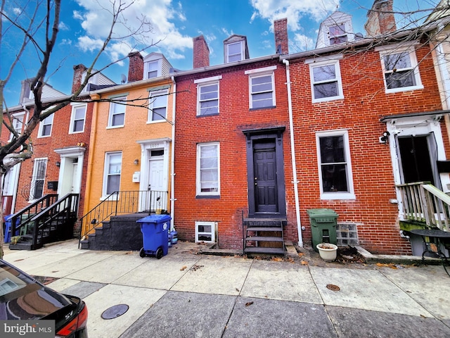 view of front of home featuring brick siding