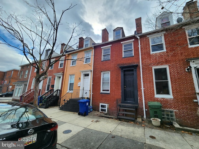 view of front of home featuring brick siding