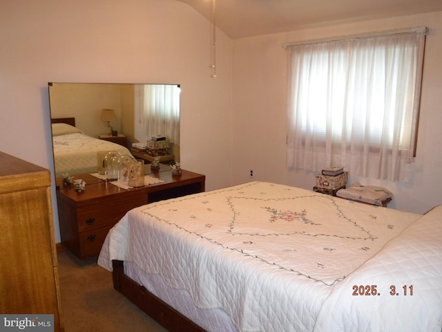 carpeted bedroom featuring vaulted ceiling