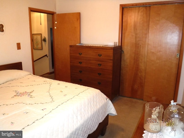 carpeted bedroom with a closet