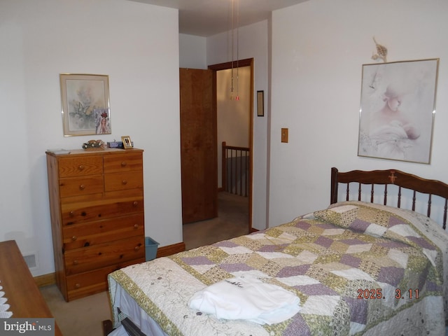 bedroom featuring visible vents and carpet