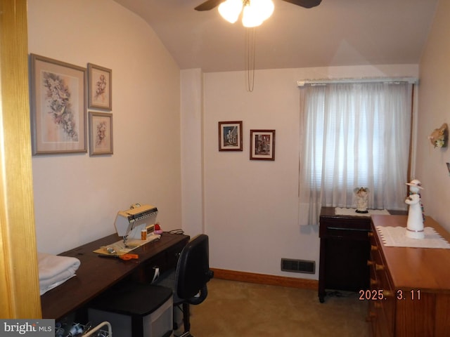 carpeted office featuring visible vents, lofted ceiling, baseboards, and ceiling fan