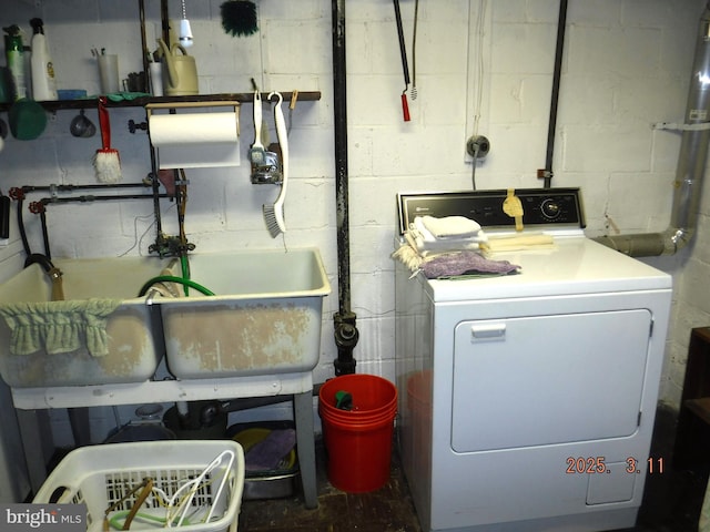 laundry area featuring washer / dryer and laundry area