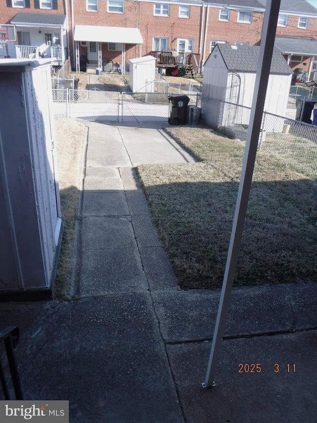 view of yard featuring a residential view and fence