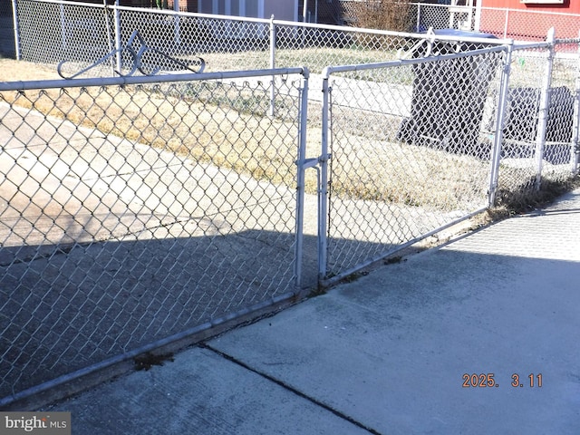 view of gate featuring fence