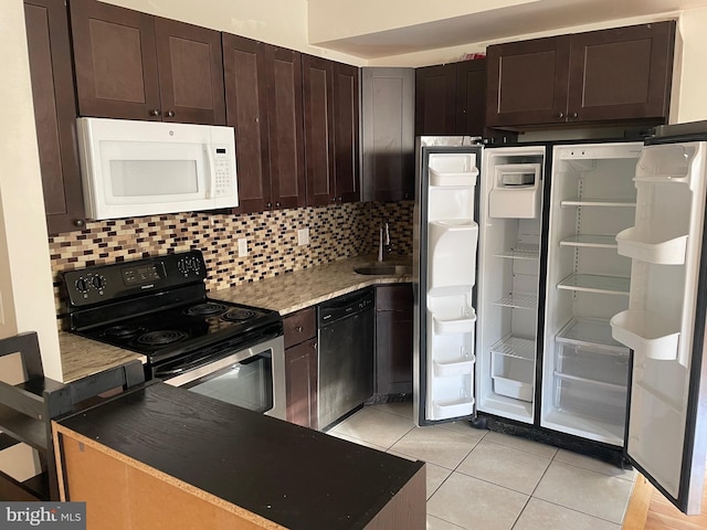 kitchen with white microwave, dishwasher, decorative backsplash, electric stove, and light tile patterned flooring