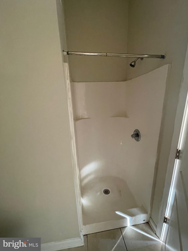 bathroom featuring tile patterned floors and walk in shower