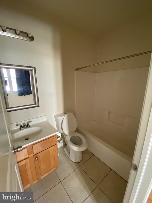 bathroom with tile patterned flooring, toilet, vanity, and shower / bath combination