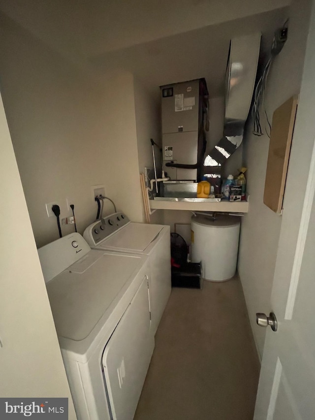 clothes washing area featuring laundry area and separate washer and dryer