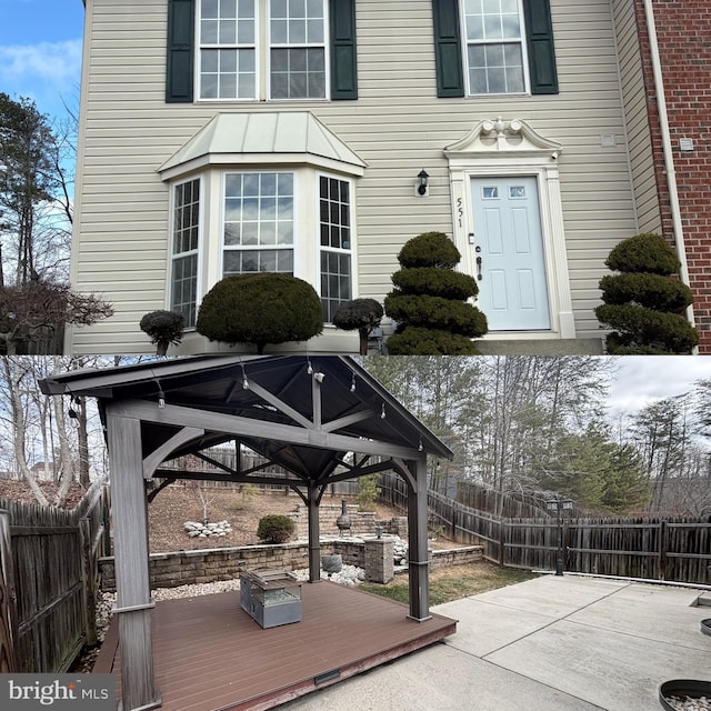 exterior space featuring a gazebo, a patio area, and a fenced backyard