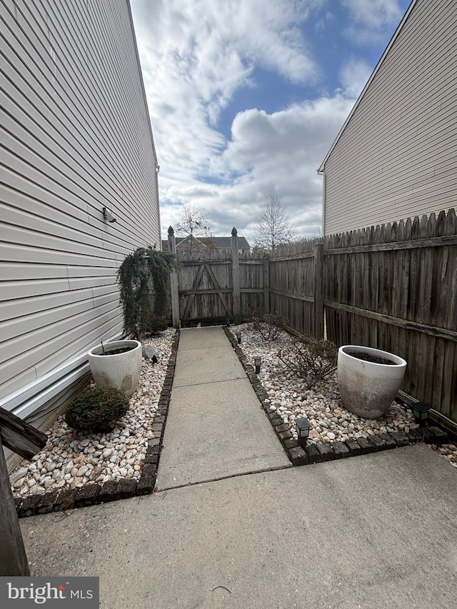 view of yard with a gate and fence