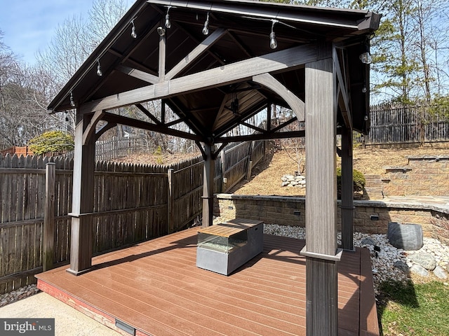 deck with a fenced backyard