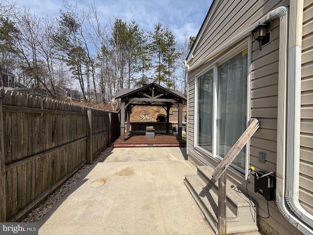 view of patio featuring a gazebo and fence