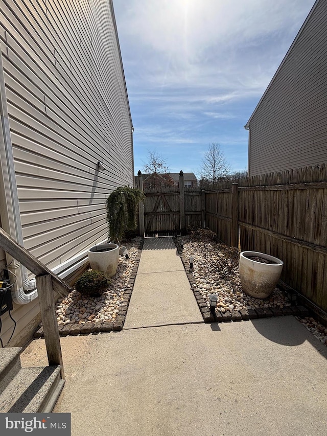 view of patio featuring fence