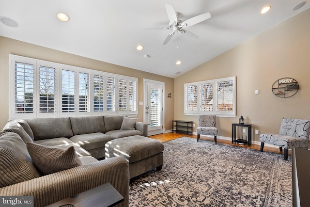 living room with lofted ceiling, a ceiling fan, wood finished floors, recessed lighting, and baseboards