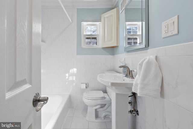 full bath featuring tile patterned floors, toilet, tile walls, and crown molding