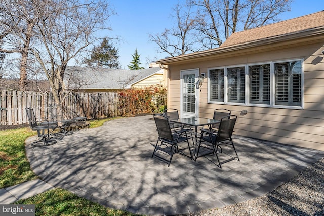 view of patio / terrace with outdoor dining space and fence