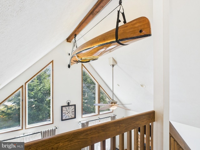 interior details with beam ceiling and ceiling fan