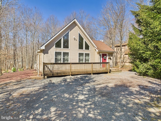 rear view of house featuring a deck